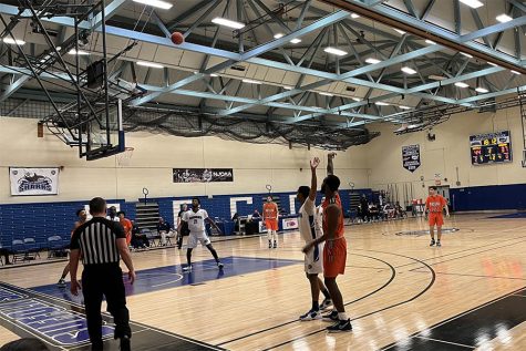 Players wait for the ball to come out of the air, from a Nassau players shot attempt at the beginning of the second half. Thursday, Feb. 3, 2022. Brookhaven Gymnasium, Selden, New York.