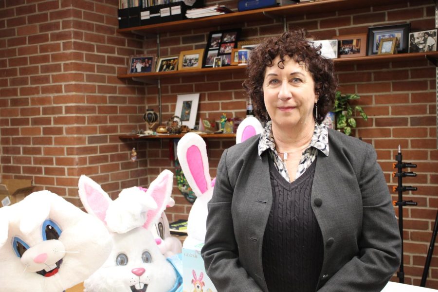 Sharon Silverstein in front of Bunny costumes inside her office at Campus Activities. (Compass News/ Thomas Ithier)