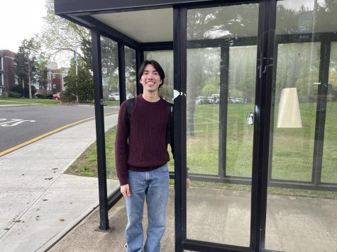 Josefelix Gomez Alviarez, a 19-year-old business administration major from Shirley, at his Suffolk County Community College bus stop on May 3, 2023. It often takes Alviarez up to two hours to arrive at school in the morning. (Compass News/James Quigley)
