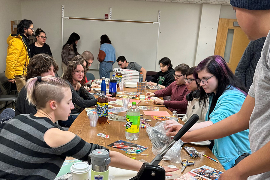 Art Club and Comic Book Club members design buttons, collages and crafts on Feb. 28, 2024. (Compass News/Carl Corry)