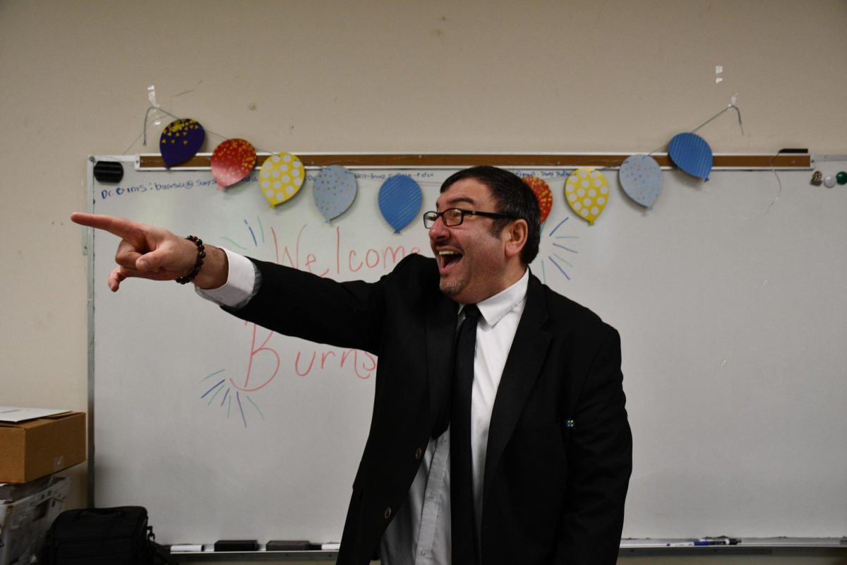 Compass adviser William Burns acknowledges unexpected guests  -- former staffers -- at the Compass News newsroom on Wednesday, May 14, 2025.