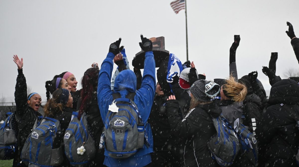 Suffolk County Community College’s women’s soccer team celebrates as they hoist the third-place trophy, marking their best finish in program history at the NCJAA Division III National Tournament. Courtesy Suffolk Athletics.